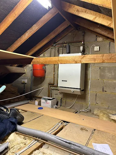 New system boiler installed in a loft with tidy pipework