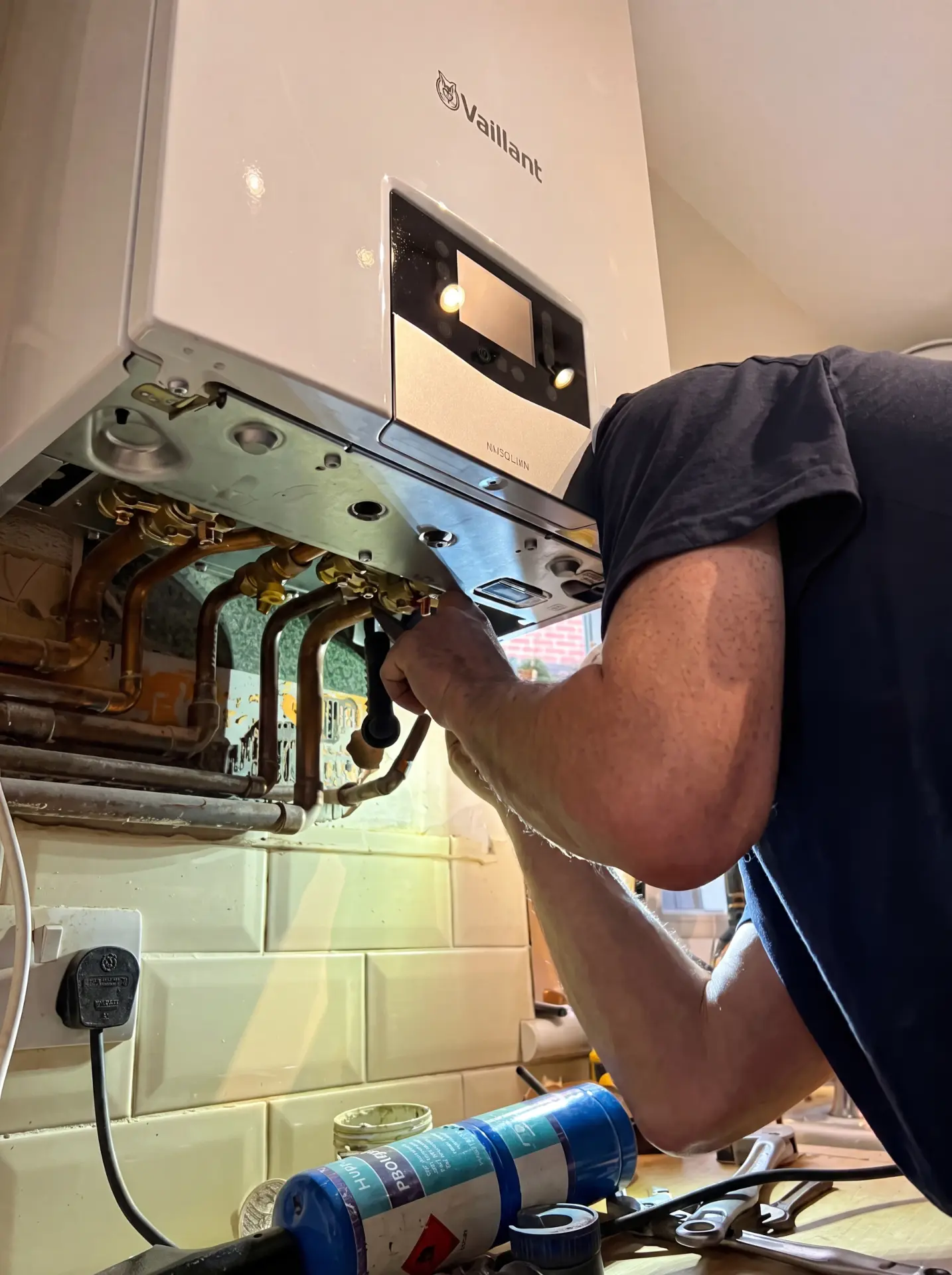 Gas Safe engineer completing a new boiler installation in a West Sussex home