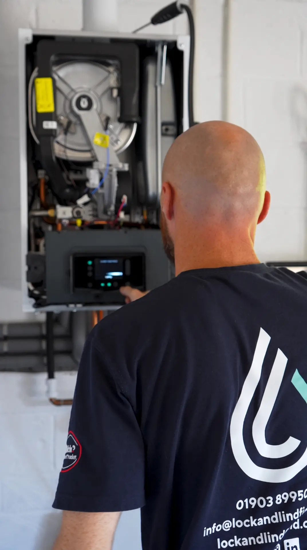 Lock & Lindfield engineer commissioning a new boiler